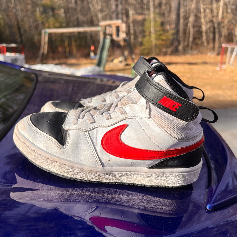 Kids black, white and red Nikes